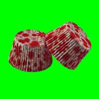 White paper baking forms for muffins and cupcakes with hearts pattern. Green screen chroma key background photo