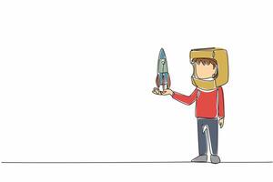 Single continuous line drawing boy holding cardboard rocket wearing cardboard helmet. Resembling spaceman. Dreams that must come true. Big dreams. Cosmonautics Day. One line design illustration vector