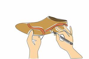 A hand holding a pair of shoes with a pair of scissors vector