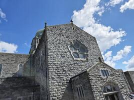 Building Window with Blue Sky and Clouds photo