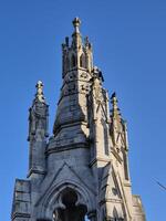 Medieval Architecture Tower with Sculpture and Steeple photo
