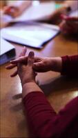Old woman close up hand hold pen sign contract put signature. video
