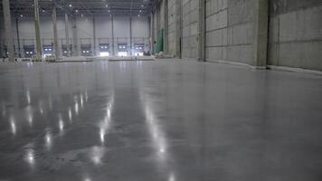 The Shiny Concrete Floor in an Industrial Warehouse Setting Looks Impeccably Clean and Modern. Clip video