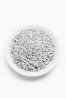Oat Kernel Bowl on Wooden Background photo