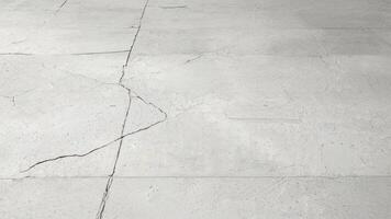 A white concrete floor with cracks in it photo
