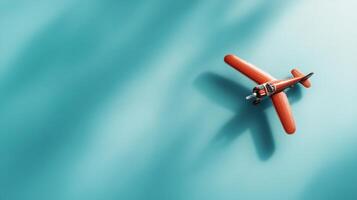 Vintage toy airplane glides over a bright turquoise background, showcasing craft and nostalgia in a playful display photo