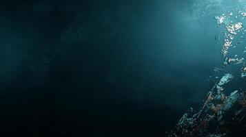 Deep underwater scene showcasing shadows and reflections in a mysterious dark ocean environment photo