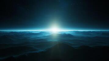 Vast tranquil landscape illuminated by a bright horizon in an expansive twilight sky over distant mountains photo