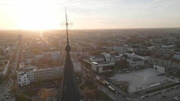Aerial view catholic cross on top of church with cityscape panorama of Siauliai city. Siauliai Cathedral. The Church of Saints Peter and Paul. Siauliai travel destination and sightseeing attraction video