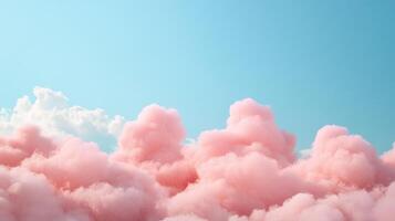 Bright pink clouds drift across a clear blue sky during a serene afternoon photo