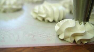 makes marshmallows with a pastry bag. Taken in close-up video