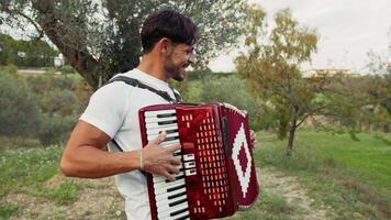 Smling Player Of Accordion Having Fun in The Countryside video