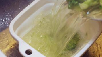 Freshly Steamed Broccoli Served in a White Container on a Wooden Table video