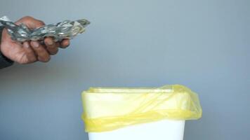 Properly Discarding Unused Medication into a Trash Bin for Better Health and Safety Practices video