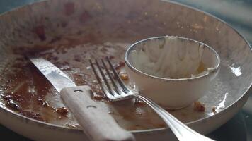 An empty plate set with cutlery and a dipping bowl for sauces or snacks video