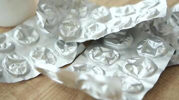 Close up of empty pills of blister pack on table video