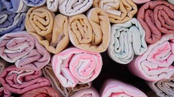 A Wide Selection of Rolled Towels Available in Various Colors and Textures video