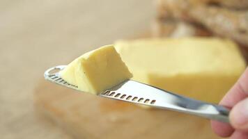 A Nice Slice of Fresh Butter on a Knife, Ready for Easy Spreading video