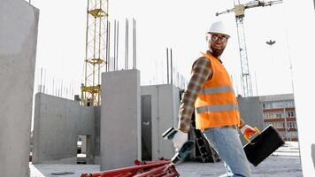 Funny construction worker dancing. Positive dance of builders in helmet. Construction engineer in builder uniform dancing on his work place video