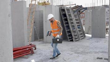 Funny construction worker dancing. Positive dance of builders in helmet. Construction engineer in builder uniform dancing on his work place video