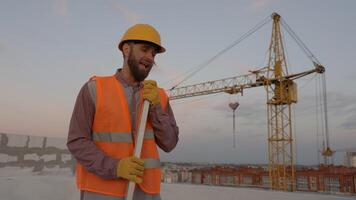 Funny construction worker dancing. Positive dance of builders in helmet. Construction engineer in builder uniform dancing on his work place video
