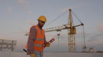 Funny construction worker dancing. Positive dance of builders in helmet. Construction engineer in builder uniform dancing on his work place video