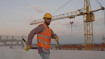 Funny construction worker dancing. Positive dance of builders in helmet. Construction engineer in builder uniform dancing on his work place video