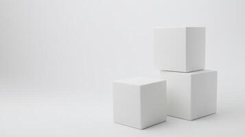 Three white cubes stacked on minimalist white background, creating simple geometric composition photo