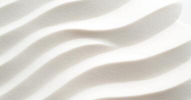 Smooth white sand with gentle wave patterns creates minimalistic and serene texture photo