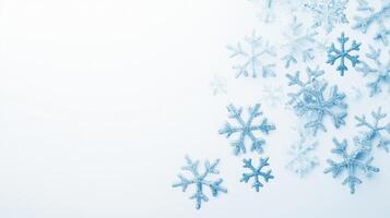 Delicate blue snowflakes scattered on white snow background, creating simple and minimalistic winter scene photo