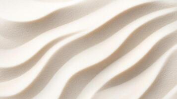 Smooth white sand background with gentle, flowing wave patterns photo