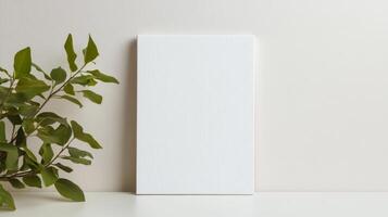 Blank canvas on table with plant, perfect for art display or mock up photo