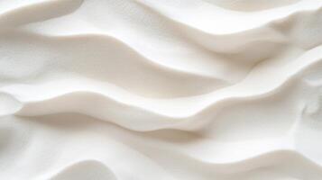 Wavy white sand texture with soft shadows creating minimalist and serene background photo