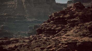 Rock formations and rugged terrain under a sky in a desert landscape video