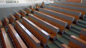 Shot of empty university classroom. Empty modern lecture style university classroom video