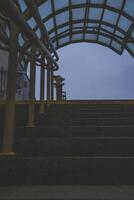 Exit from the underpass in the evening. Cloudy sky. Steps up photo