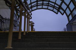 Exit from the underpass in the evening. Cloudy sky. Steps up photo