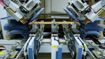 Manufacturing plant with computerized automation. Computerized automation manufacturing furniture in factory video