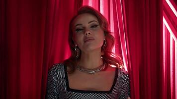 Pop singer performs gentle love song. She expresses her emotions through body language and gestures as she performs her complex vocal part. Portrait. video