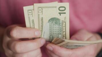 Closeup of hands counting cash, highlighting the importance of effective money management practices video
