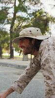 Soldier Crawls On The Ground And Smiling Approaches A Cat To Save It video
