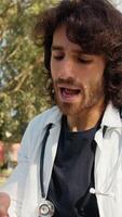 Young Charming Man Doctor Trainee Repeats Study Outside in University Field video