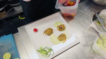 Plating Of A Raw And Cooked Fish Based Appetizer In A Luxury Italian Kitchen video