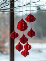Red paper origami hanging decorations creating festive atmosphere photo