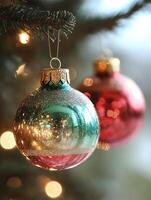 Shiny christmas ornaments hanging on a christmas tree photo