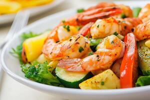 Grilled shrimp salad with roasted vegetables and fresh herbs photo