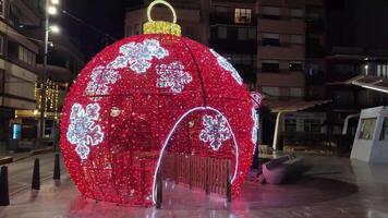 Beautiful illumination in the form of a tent over the New Year tree in the city. video