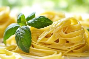 Delicious pasta with basil leaves fettuccine with aromatic herb photo