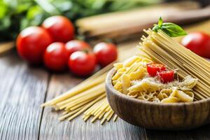 Italian pasta variety with tomatoes and basil on rustic wooden table photo