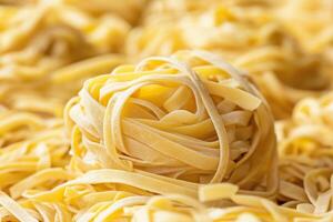 Tagliatelle pasta nest close-up of delicious italian cuisine photo